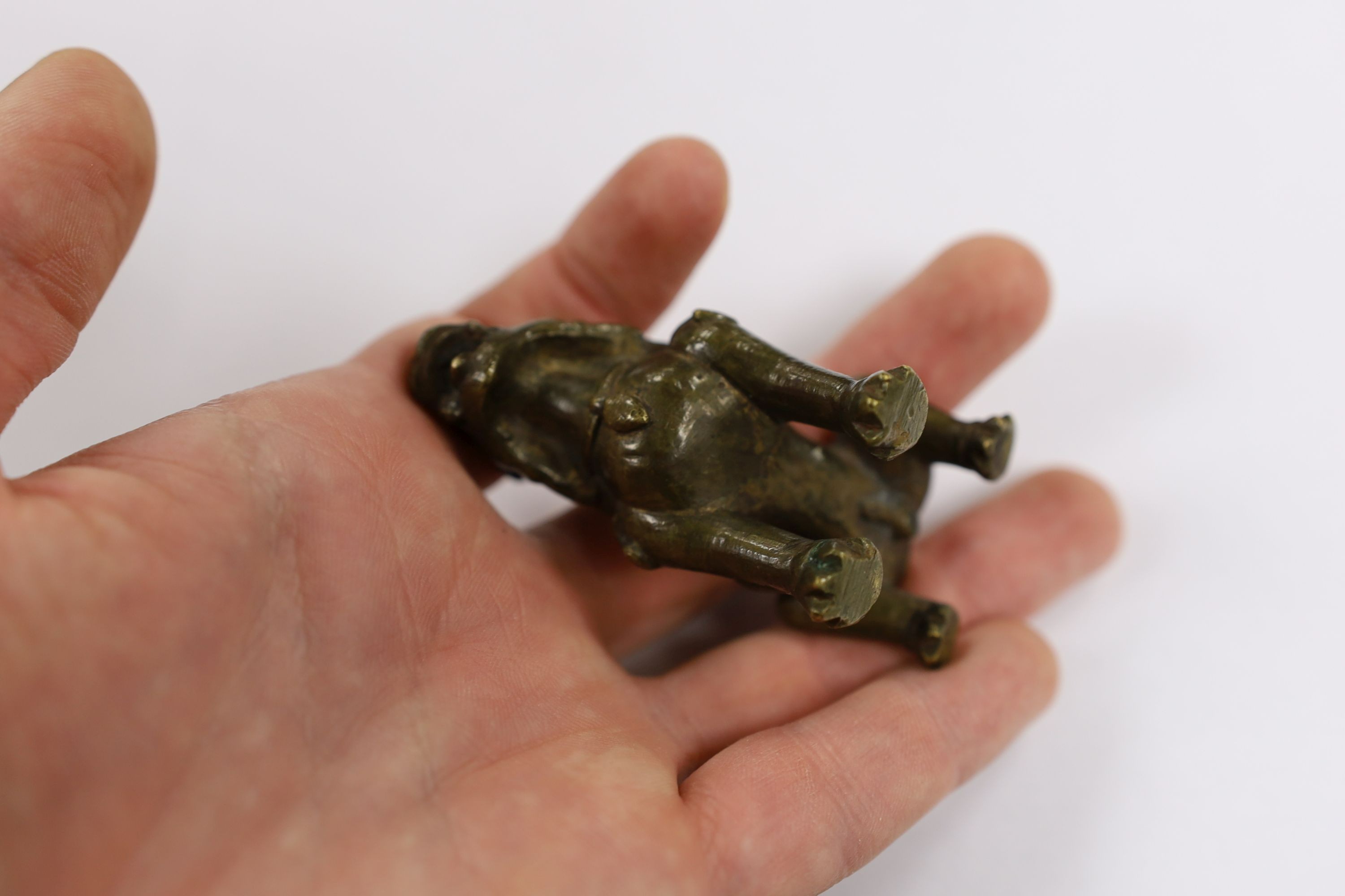 Five Chinese or Tibetan bronze figures or Buddhist implements, tallest 13cms high